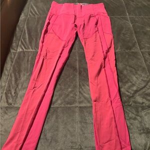 Lululemon High-Rise Active Leggings in Deep Pink, inside waist with design.